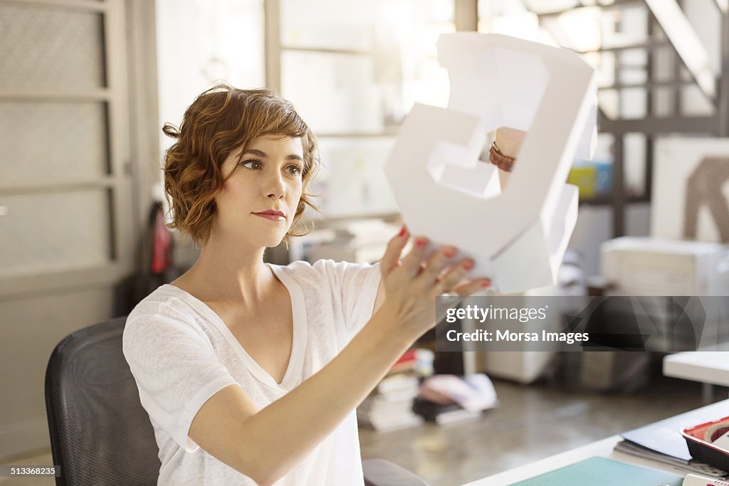 Businesswoman holding model