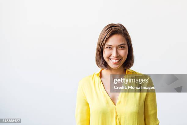 happy young businesswoman - brown hair white background stock pictures, royalty-free photos & images