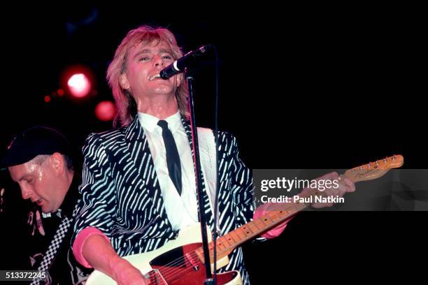 American musicians Rick Nielsen and Robin Zander of Cheap Trick perform onstage at the Poplar Creek Music Theater, Chicago, Illinois, 1980s or 1990s.