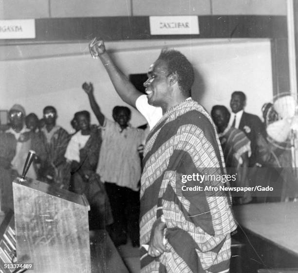 Kenneth Kaunda raising three loud cheers to support Dr Kwame Nkrumah during a speech, Ghana, Africa, 1960.