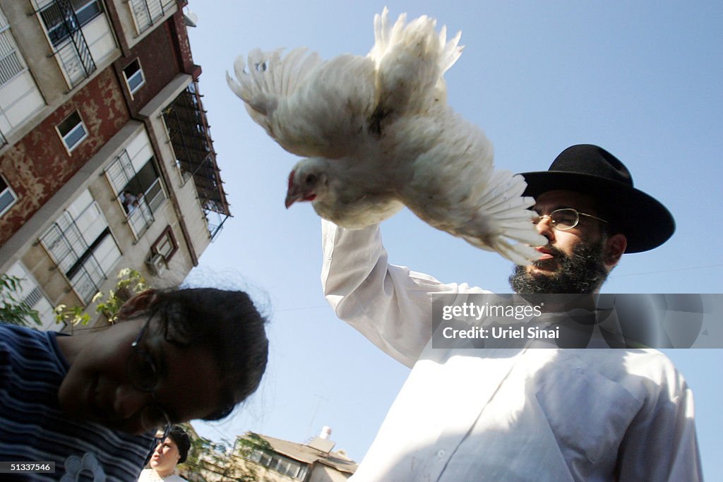Kaparot Ritual An Ultra-Orthodox Jew waves chicken above a childs head during the ...