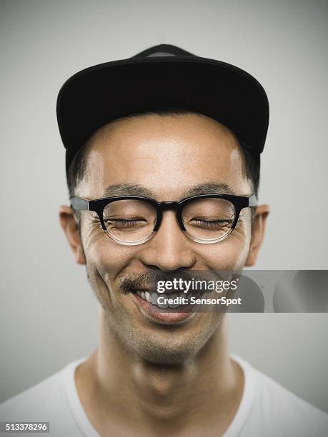 portrait of a young japanese man with big smile - dream big stockfoto's en -beelden