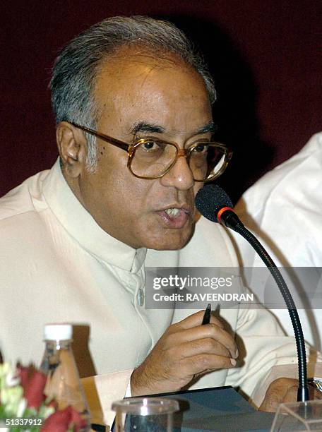 Indian State of West Bengal's Finance Minister and chairman of the Empowered Committee on Value-Added Tax Asim Dasgupta speaks during a conference in...