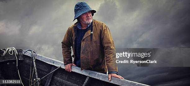 pescatore ritratto, tempestosa cielo e san pietro, nova scotia - pescatore foto e immagini stock