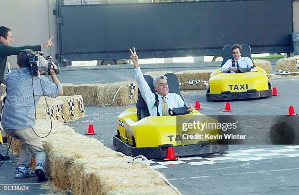 Actor Jimmy Fallon races Jay Leno on "The Tonight Show with Jay Leno" at the NBC Studios on September 22, 2004 in Burbank, California.