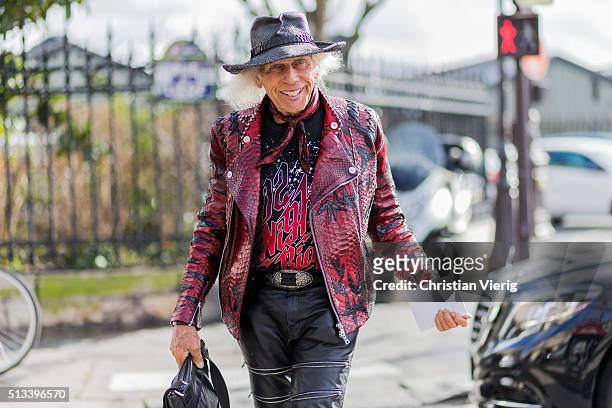 James Goldstein wearing a black vintage hat, a red leather jacket and black leather pants outside Dries van Noten during the Paris Fashion Week...