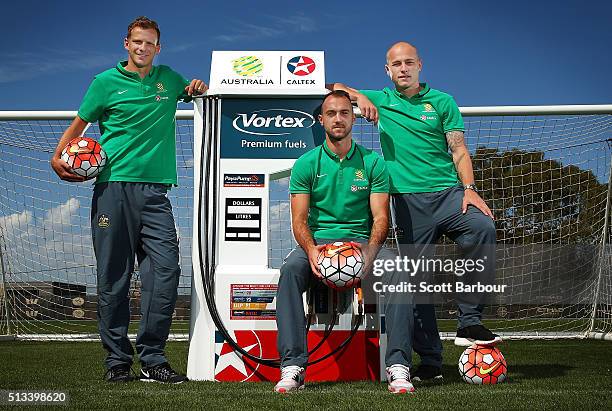 Caltex Socceroos players Aaron Mooy, Ivan Franjic and Alex Wilkinson pose during a Socceroos sponsorship announcement at Melbourne City Training...