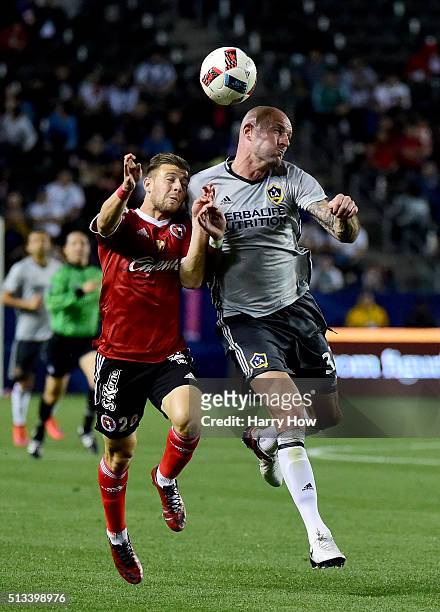 Jelle Van Damme of the Los Angeles Galaxy and Paul Arriola of Club Tijuana attempt a header during the first half at StubHub Center on February 9,...