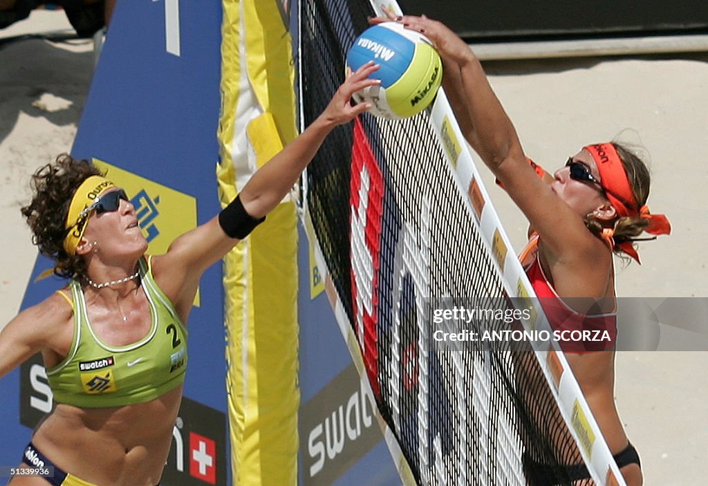 Shelda Brazilian beach volleyball player Shelda Bede hits the ball against ...