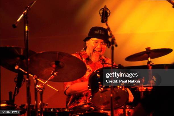 American musician Bun E Carlos plays drums with the band Cheap Trick during a performance at the Poplar Creek Music Theater, Chicago, Illinois, June...