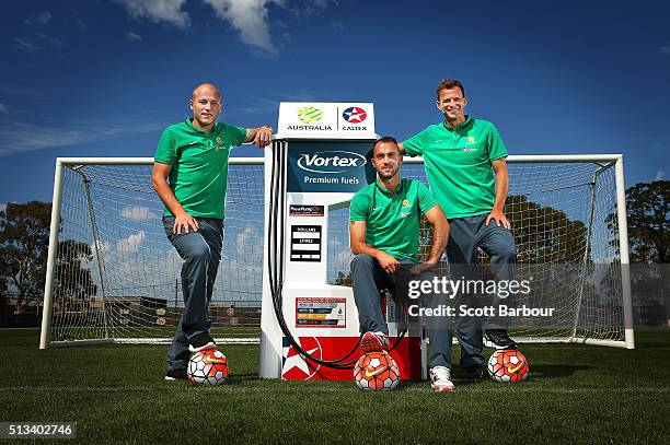 Caltex Socceroos players Aaron Mooy, Ivan Franjic and Alex Wilkinson pose during a Socceroos sponsorship announcement at Melbourne City Training...