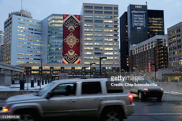 Famous street artist Shepard Fairey's 184-foot by 60-foot mural on the side of the One Campus Martius building is seen in downtown March 2, 2016 in...