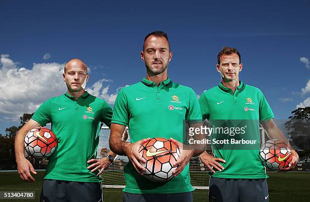 Caltex Socceroos players Aaron Mooy, Alex Wilkinson and Ivan Franjic pose during a Socceroos sponsorship announcement at Melbourne City Training...