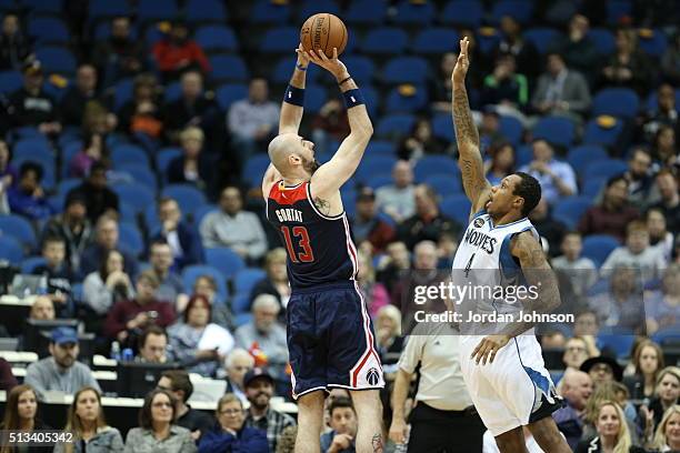 Marcin Gortat of the Washington Wizards shoots against Greg Smith of the Minnesota Timberwolves on March 2, 2016 at Target Center in Minneapolis,...