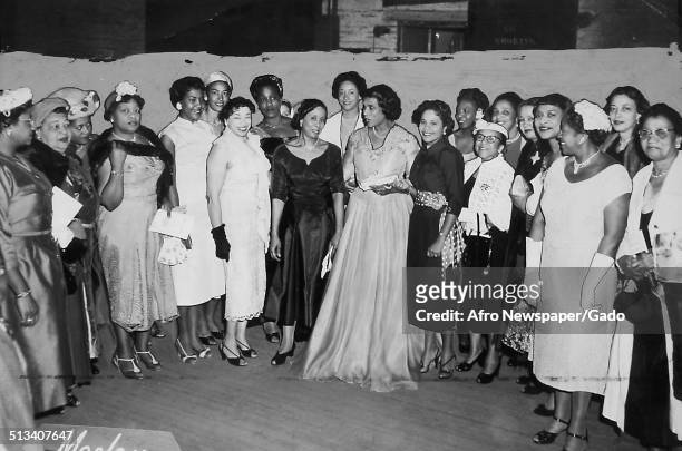 African-American singer Marian Anderson and members of the Alpha Kappa Alpha sorority receiving an award at the Philadelphia Academy of Music,...