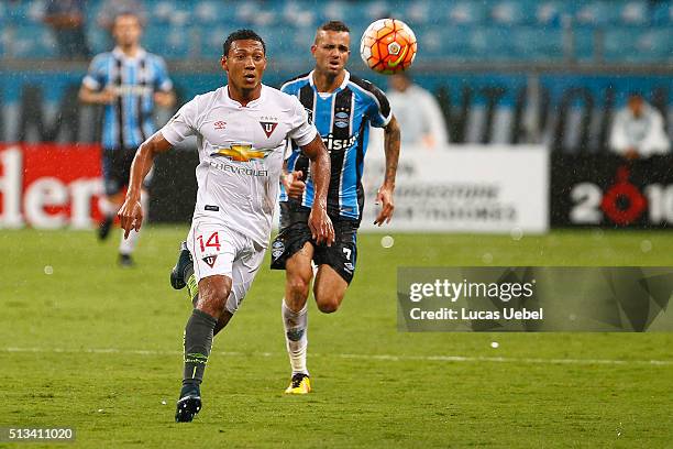 Luan of Gremio battles for the ball against Jose Quintero of Liga de Quito during the match Gremio v Liga de Quito as part of Copa Bridgestone...