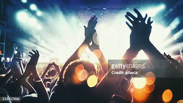 concert crowd. - applauding stock pictures, royalty-free photos & images