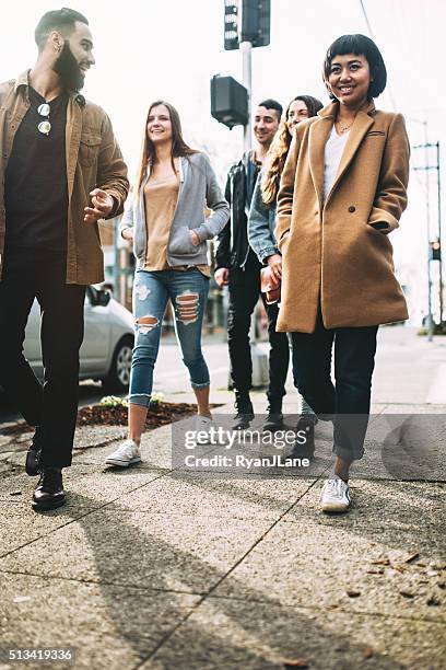 group of friends in seattle city setting - seattle city life stock pictures, royalty-free photos & images