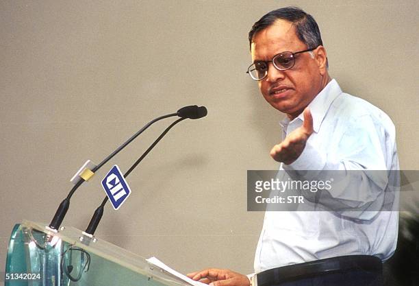 Chairman and CEO of Infosys Technologies Limited, N.R. Narayana Murthy gestures while delivering the keynote address at a conference on "Quality and...