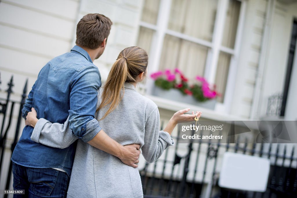 Couple holding house keys