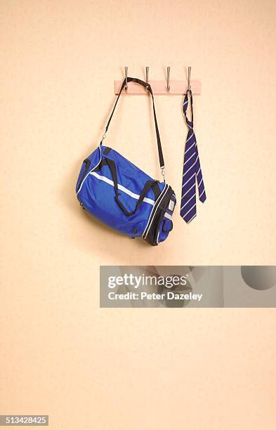 coat rack in sports changing room - school tie stock-fotos und bilder