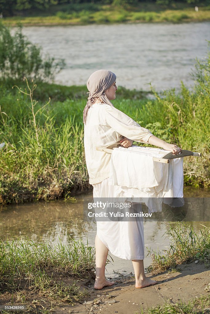 Woman standing with clear laundry