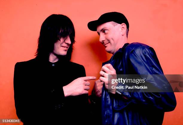 Portrait of American musicians Todd Rundgren and Rick Nielsen, guitarist for Cheap Trick, as they pose backstage at Park West, Chicago, Illinois,...