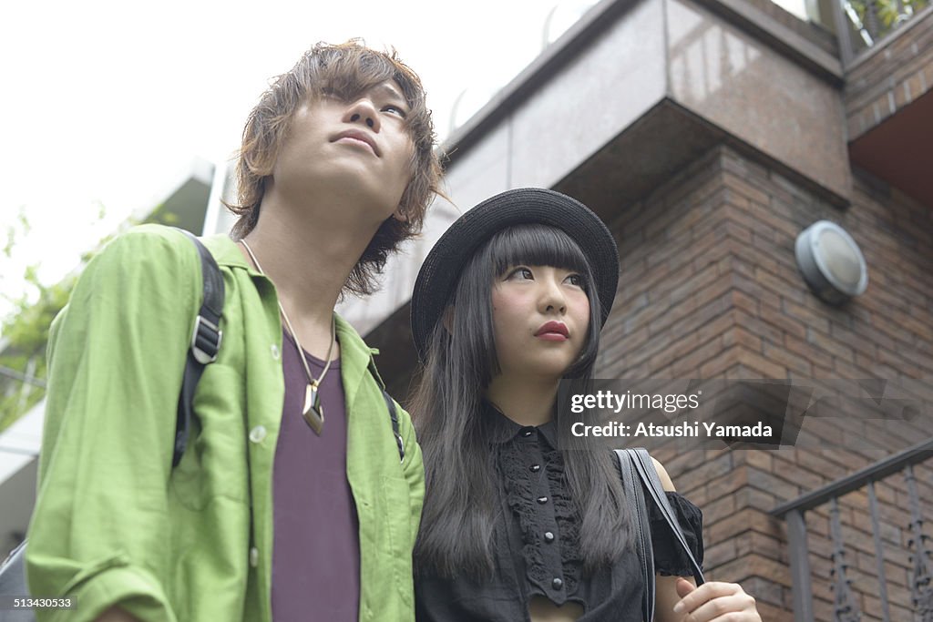 Harajuku couple on street,looking up