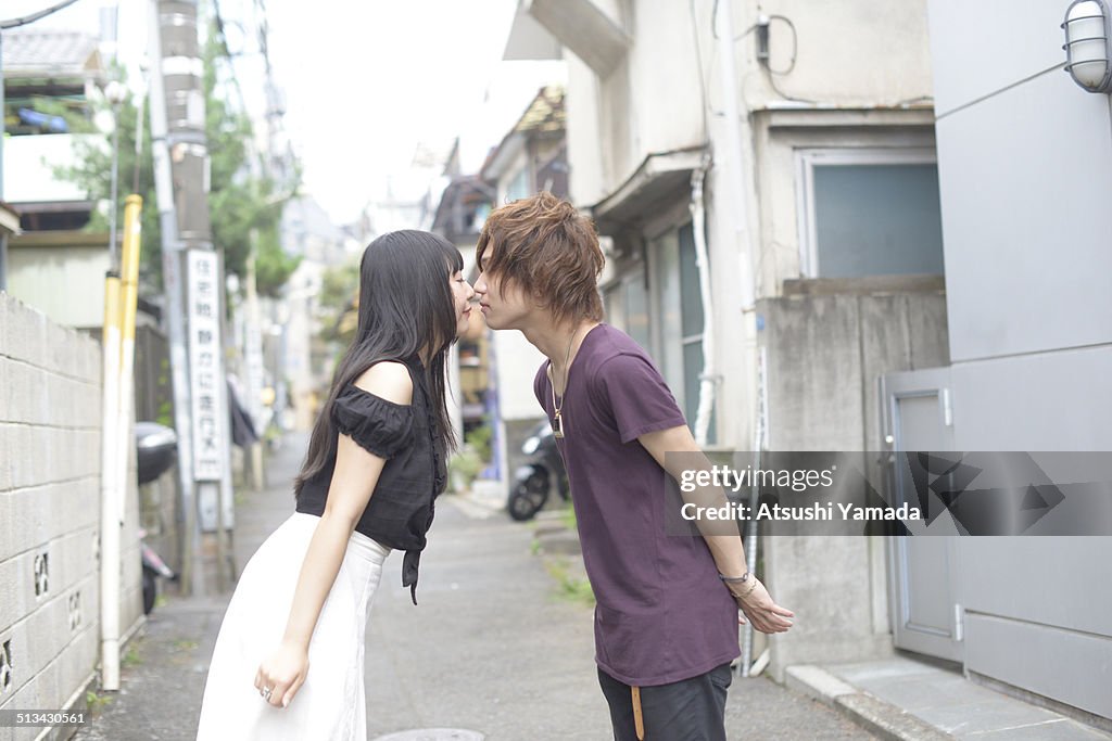 Harajuku couple kissing on street