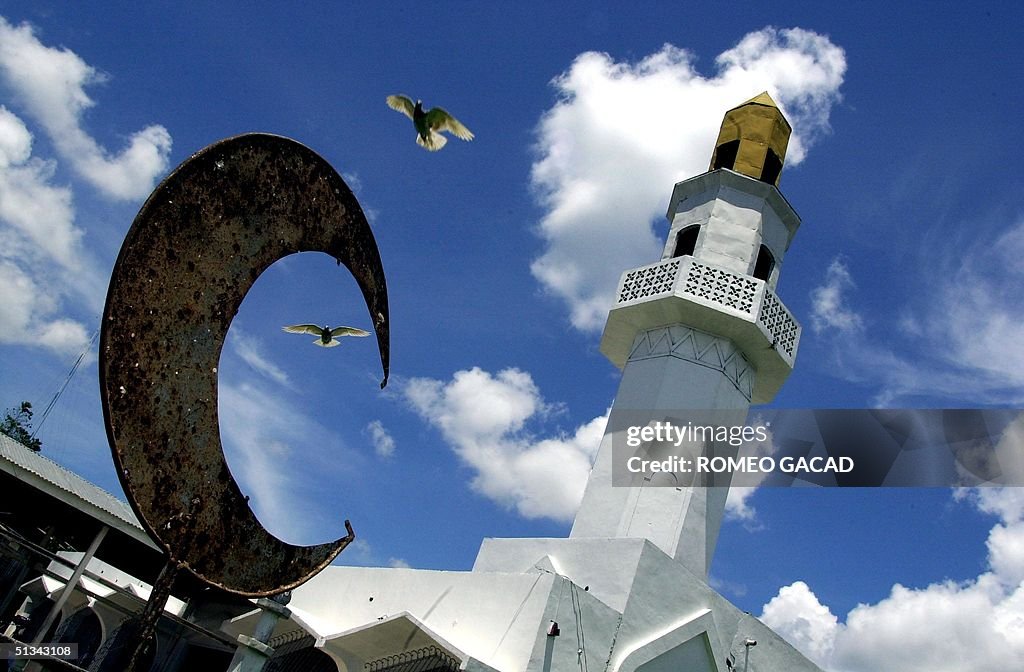 Doves fly over the crescent moon, the symbol of Is