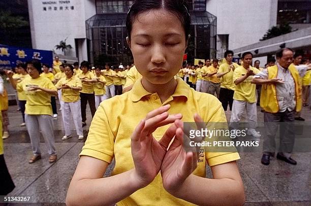 Falun Gong followers practice outside Immigration Tower in Wanchai, Hong Kong, 09 May 2001, close to the venue of the Fortune Economic Forum. The...