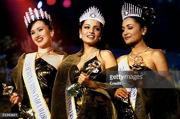 Twenty-one-year-old Celina Jaitley is crowned Femina Miss India-Universe at a ceremony in Bombay, 27 January 2001. At left is 20-year-old Femina Miss...