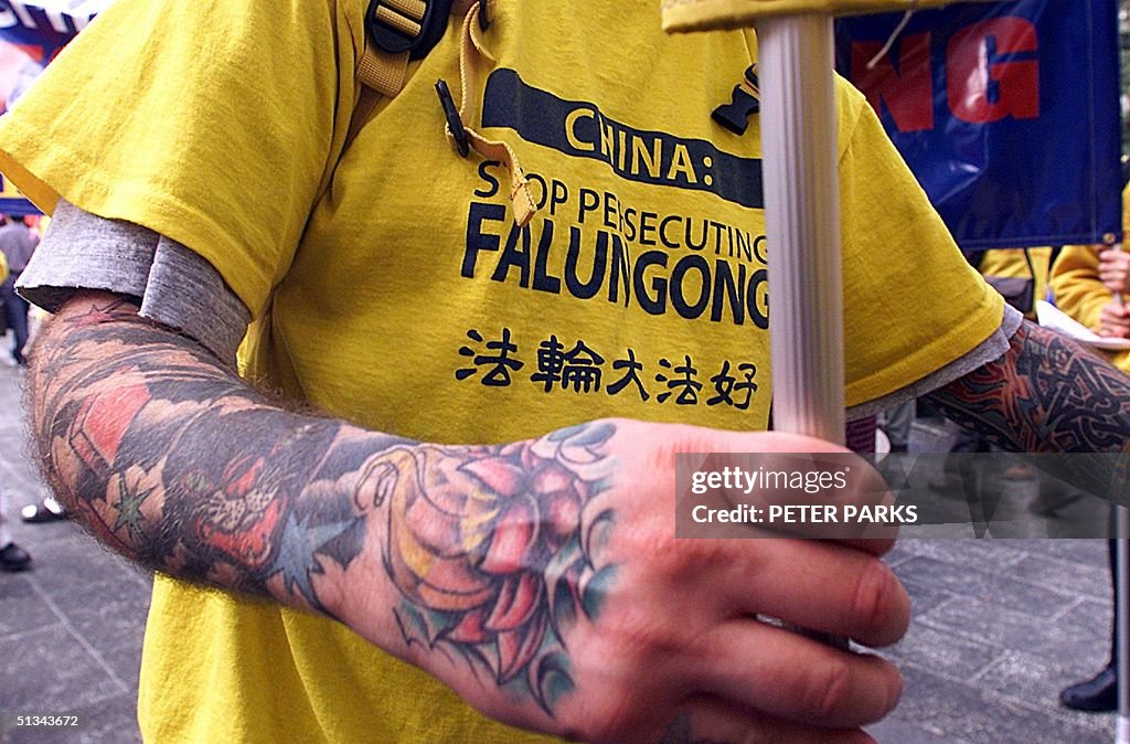 A heavily tattooed Falun Gong member from Boston i