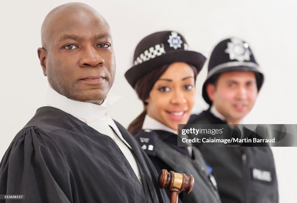 Portrait of confident judge and police