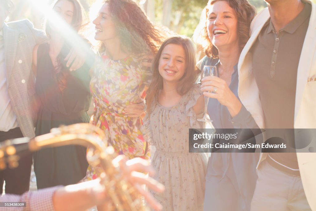 Family dancing together outdoors