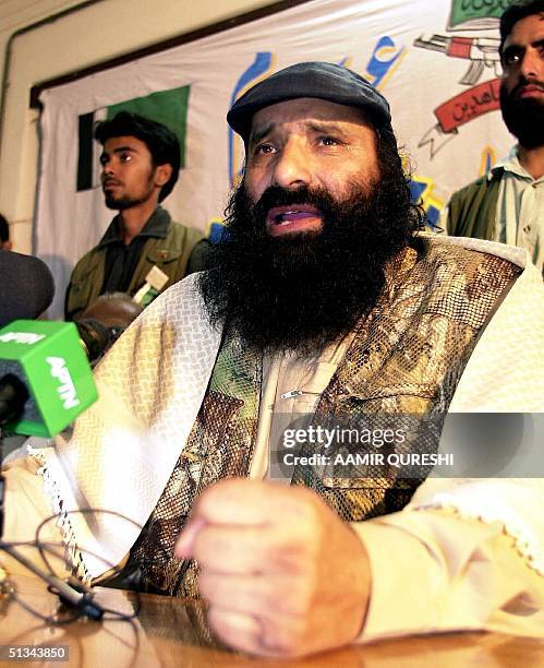 Hizbul Mujahideen chief Syed Salahuddin pounds his fist on the table as he rejects India's ceasefire offer during a press conference in Karachi, 24...