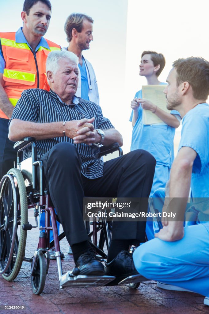 Nurse talking to patient outside hospital