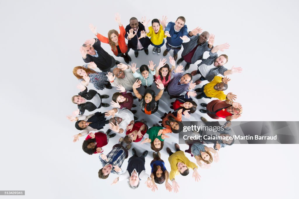 Portrait of enthusiastic business people in circle