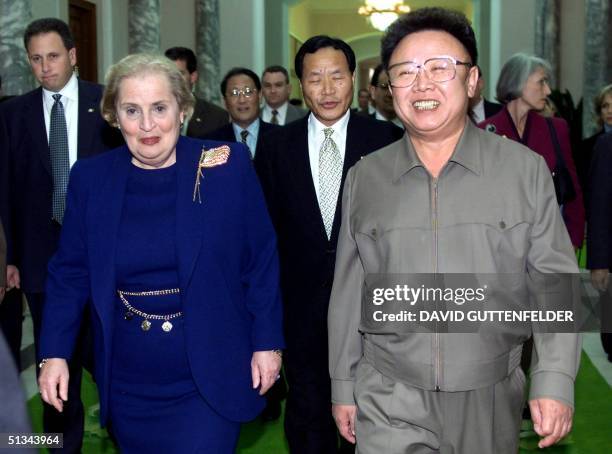 North Korean Leader Kim Jong Il and US Secretary of State Madeleine Albright , walk towards a conference room at the Pae Kha Hawon Guest House in...