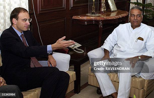 Italian Minister for Industry and Foreign Trade Enrico Letta gestures as he speaks with Indian Finance Minister Yashwant Sinha, during talks at the...