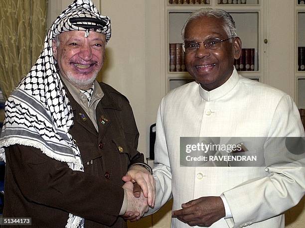 Palestinian leader Yasser Arafat and Indian President K.R. Narayanan shake hands at the Presidential palace in New Delhi, 19 August 2000. Arafat is...