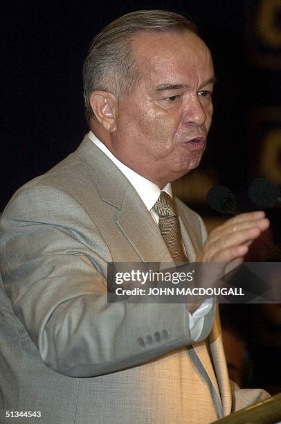 Uzbek President Islam Karimov gestures during his speech to Indian businessmen during a Confederation of Indian Industry function in New Delhi 03 May...