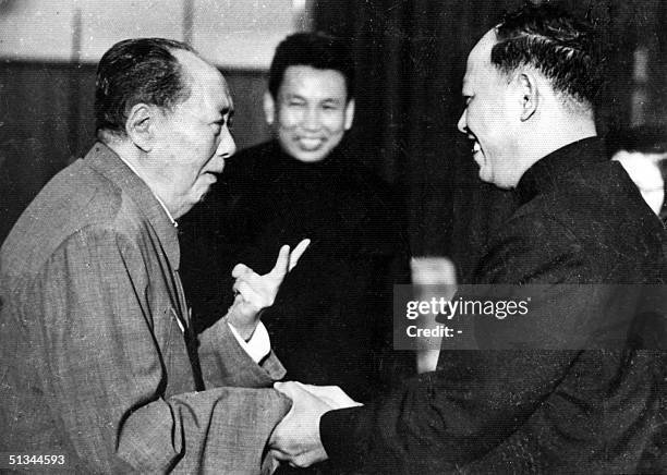 Photo taken in the 1970's outside of Cambodia, shows China's chairman Mao Zedong greeting top Khmer Rouge official Ieng Sary , also known as "...