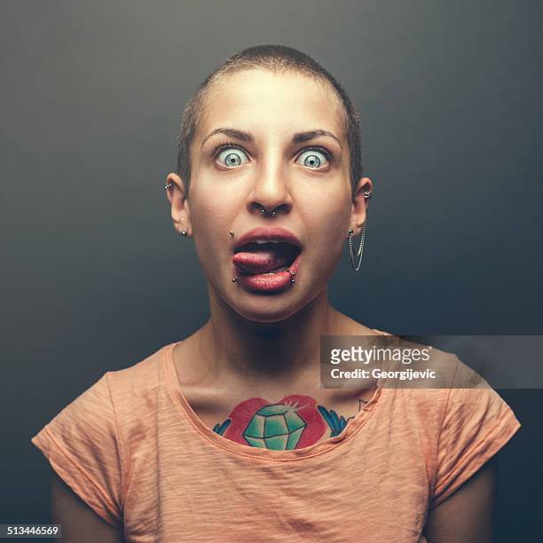 woman with tattoo - earring stud stock pictures, royalty-free photos & images