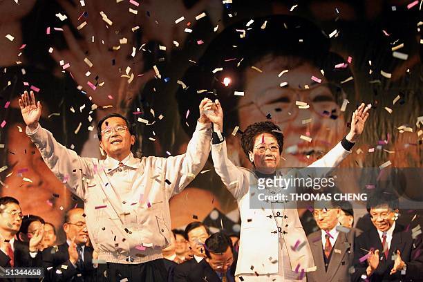Jubilant Chen Shui-bian and running mate Annette Lu acknowledge their supporters 18 March 2000 in Taipei, following announcement of victory for the...