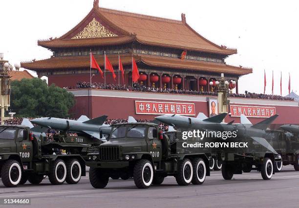 October 1999 file photo shows Chinese missiles rolling past Beijing's Tiananmen Gate during a massive parade to celebrate the 50th anniversary of the...