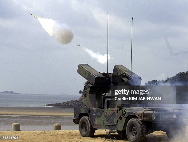 Army artillery unit fires a Stinger ground-to-air missile over the Yellow Sea, 08 March 2000, during a live-fire exercise by US forces in Taechon, on...