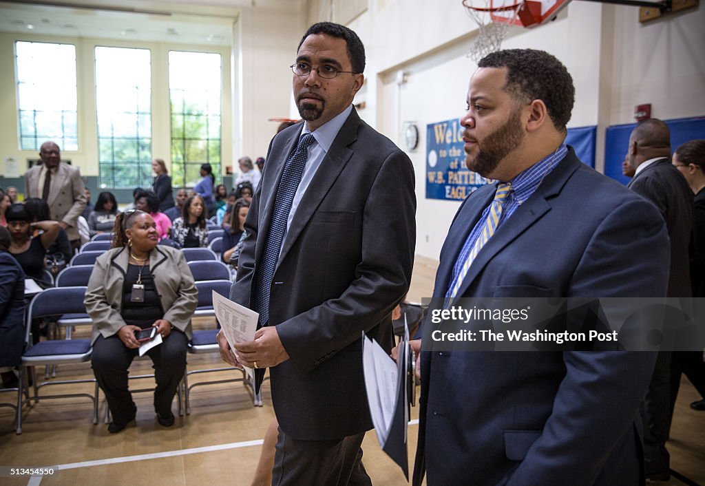 Students honored for decreased absenteeism at Patterson Elementary School with officials from Department of Education.