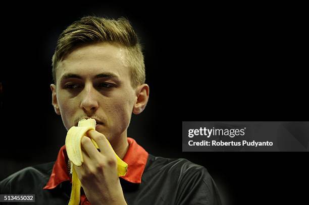 Liam Pitchford of England eats banana during the game against Jakub Dyjas of Poland in the 2016 World Table Tennis Championship Men's Team Division...