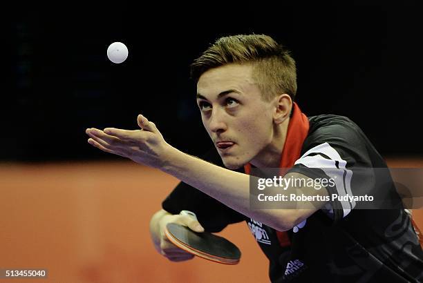 Liam Pitchford of England competes against Jakub Dyjas of Poland during the 2016 World Table Tennis Championship Men's Team Division round 16 match...